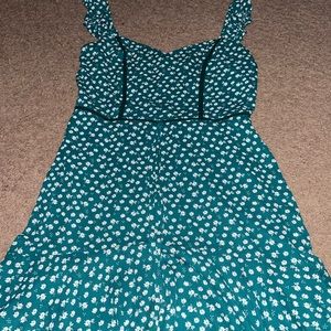 Emerald green and white floral dress with ruffled sleeves and tie in front